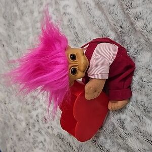 Holding a heart troll